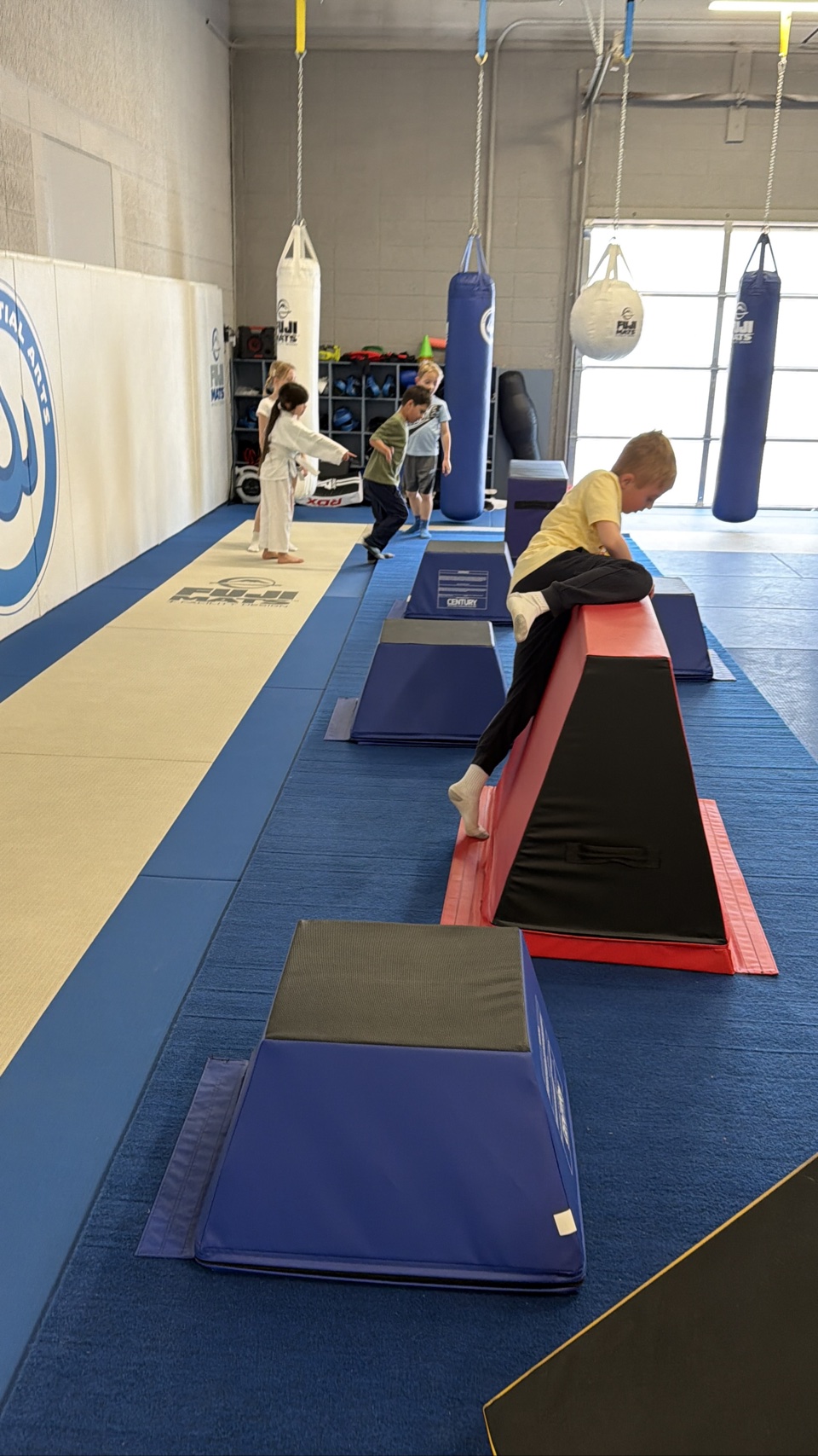 Child vaulting an obstacle in Ninja Fit at Stoic Martial Arts in Chanhassen, Minnesota
